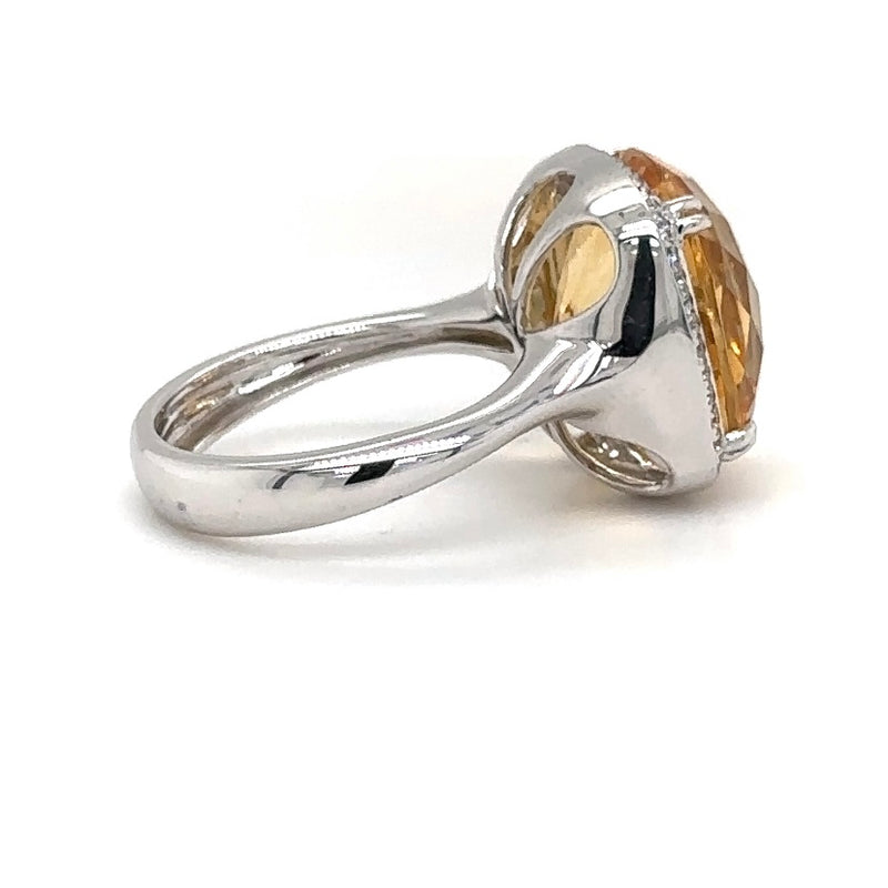 Modern white gold ring in 14 carat with a light yellow citrine and fine diamonds