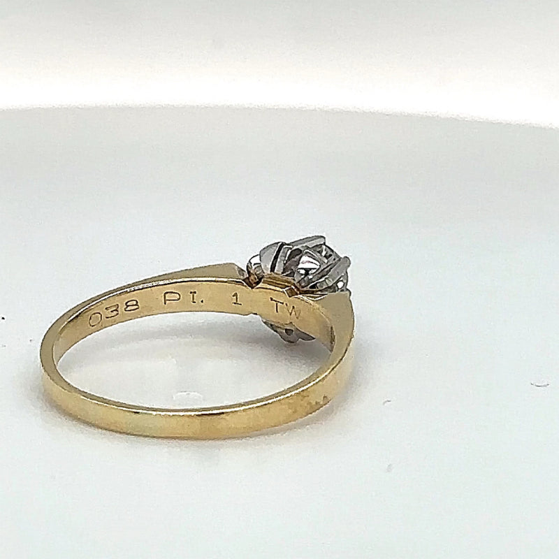 Handmade solitaire ring in 14 carat yellow and white gold with fine diamonds