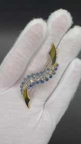 Prunkvolle Brosche in 18 Karat Gelb- und Weißgold mit blauen Saphiren und Brillanten