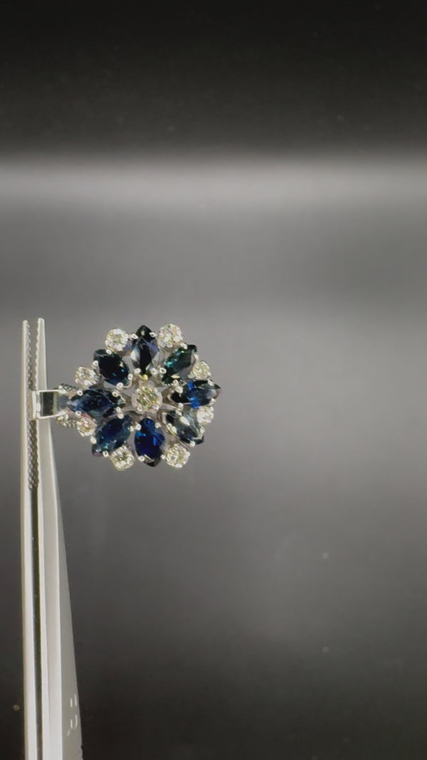 Beautiful vintage flower in 14 carat with fine sapphires and brilliant-cut diamonds, with chain