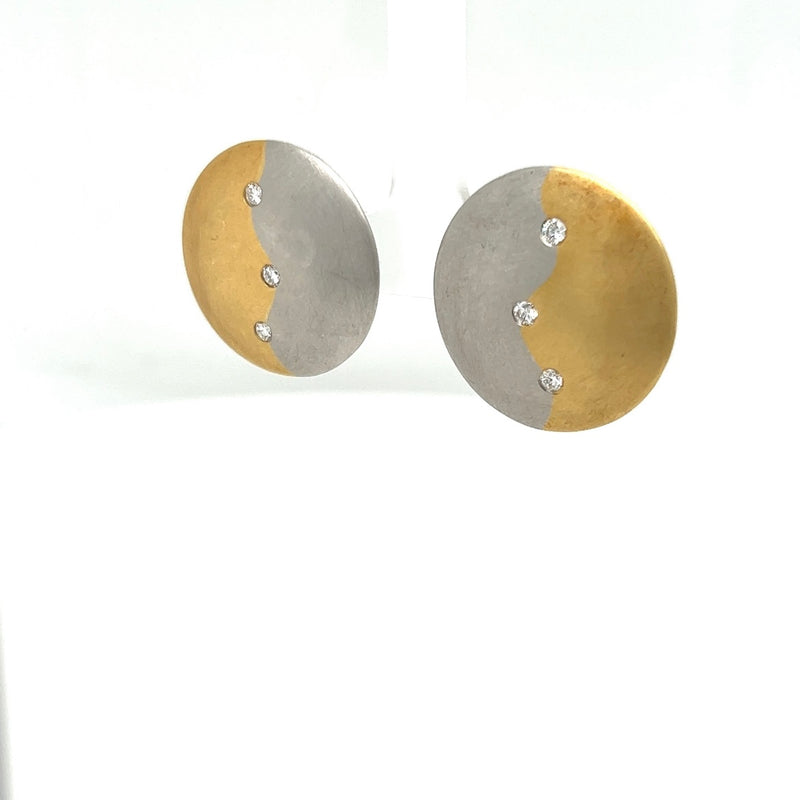 Handmade earrings in 18 carat yellow gold and 950/-. Platinum with diamonds