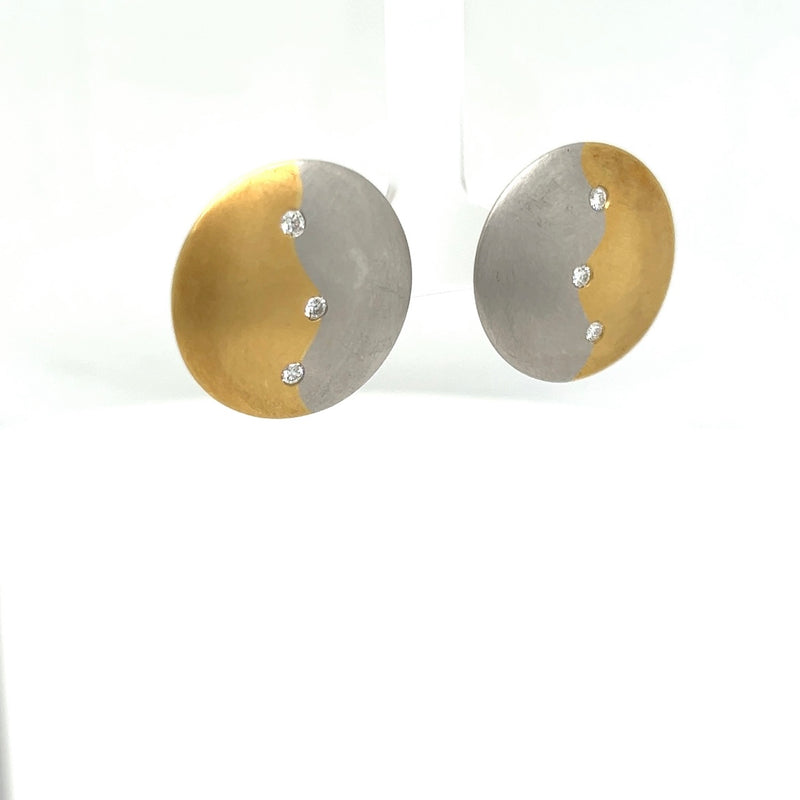 Handmade earrings in 18 carat yellow gold and 950/-. Platinum with diamonds