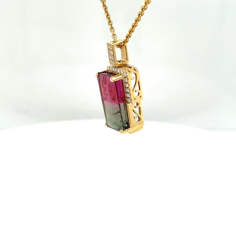 Bicolor watermelon tourmaline in 18 carat yellow gold with diamonds and certificate