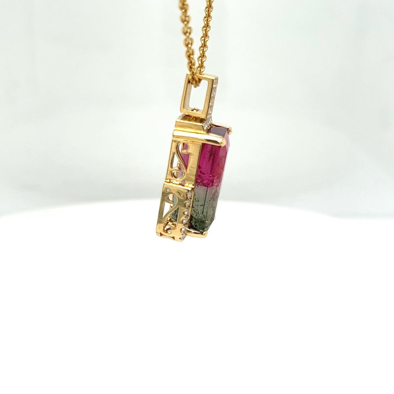 Bicolor watermelon tourmaline in 18 carat yellow gold with diamonds and certificate