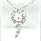 Unique pendant in 18 carat white gold with a large South Sea pearl and brilliant-cut diamonds