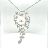 Unique pendant in 18 carat white gold with a large South Sea pearl and brilliant-cut diamonds