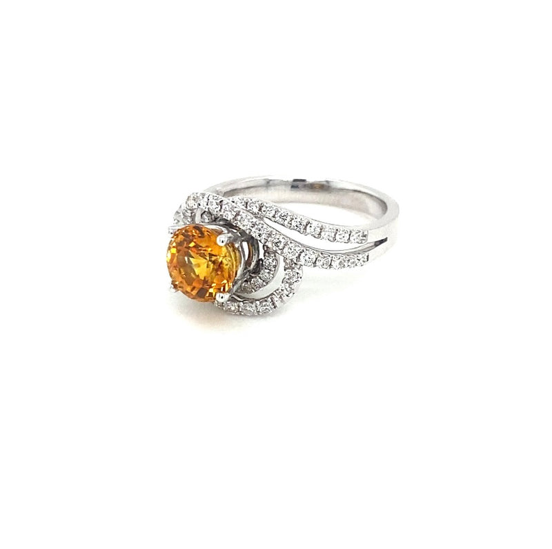 Ring in 750/-. Weißgold mit einem gelben Saphir und Brillanten