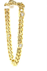 Stevige en hoogwaardige armband van 18 karaat geelgoud met 4 grote briljant geslepen diamanten