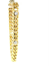 Solid and high-quality bracelet in 18 carat yellow gold with 4 large brilliant-cut diamonds