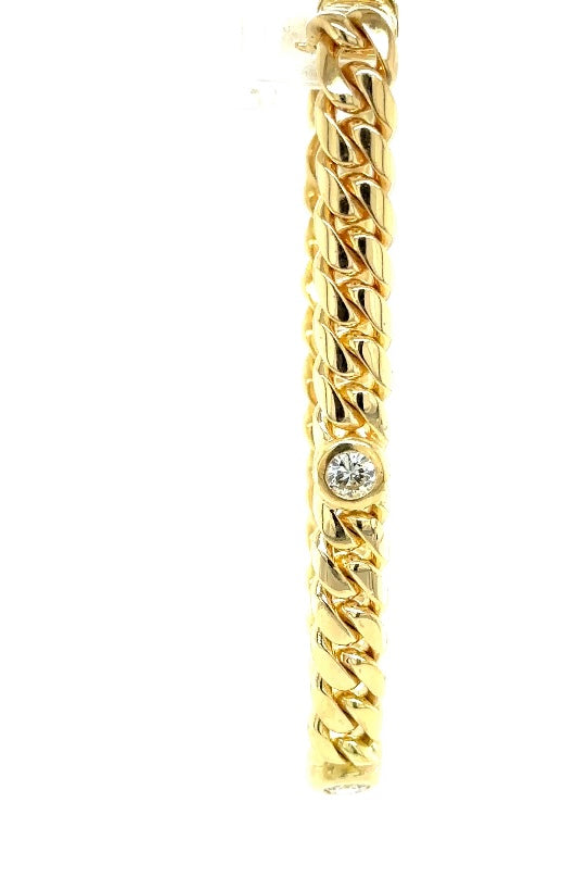 Stevige en hoogwaardige armband van 18 karaat geelgoud met 4 grote briljant geslepen diamanten